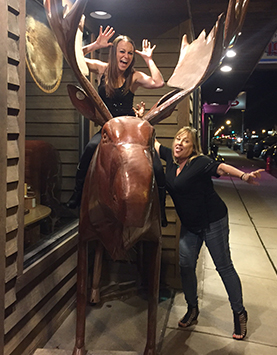 Nikki and Laura with a moose